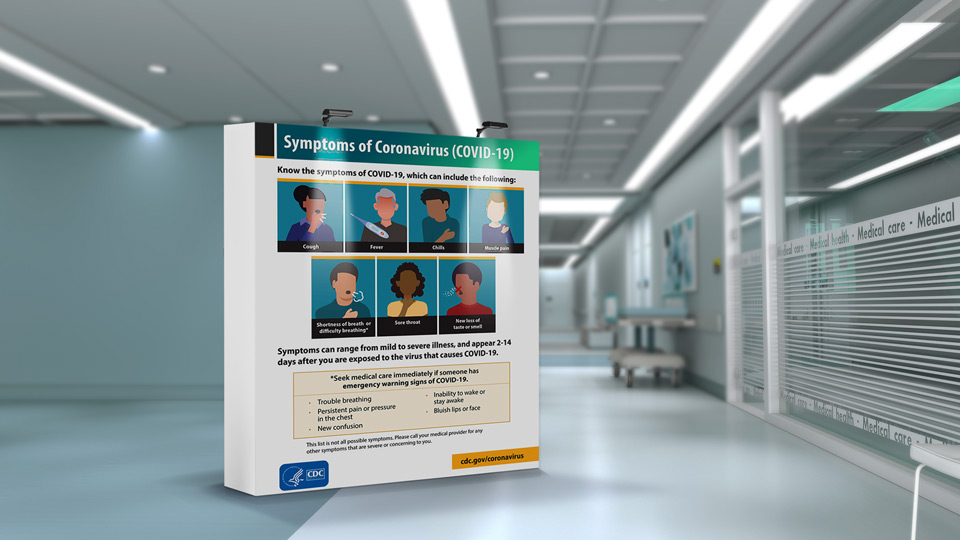 Pop up banner with LEDs warning of Covid 19 symptoms placed in a hospital