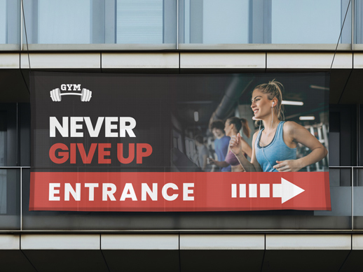 business banner advertisement that indicates the entrace of a gym with inspirational text
