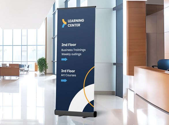 Wayfinding pull up banner for a learning center set up inside the building