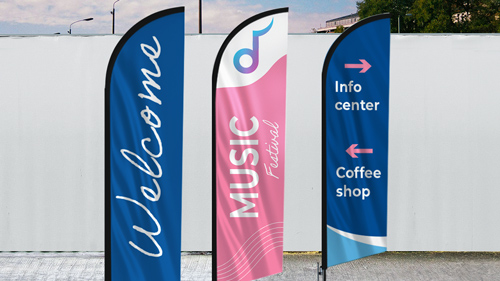 Three flag banners featuring promotional and wayfinding information installed outside