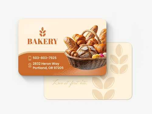 Rounded orange bakery business cards with photo of baked goods